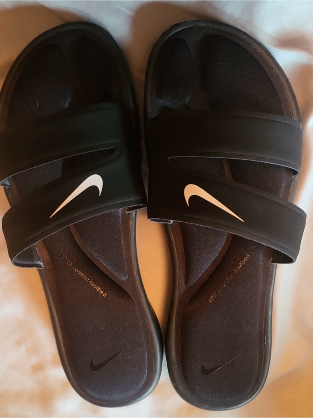 Nike Women's Black Slide Sandals with White Swoosh Accent